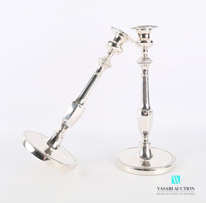 null Pair of candlesticks in silver plated metal, it presents a round base hemmed...