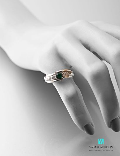 null A. Roure, ring in gold 750 thousandth set with a central green stone with three...