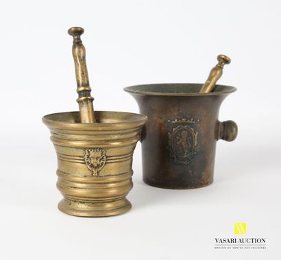 null Two bronze mortars and their pestle, one decorated with medallions presenting...