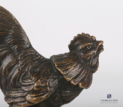 null Subject in bronze with brown patina representing a rooster walking.
Height....