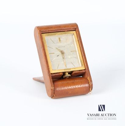 null JAEGER LECOULTRE
Travel alarm clock in gilt brass, the rectangular dial with...