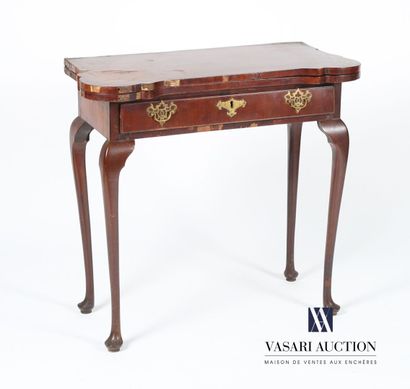 null Mahogany and mahogany veneer game table, the rectangular top with a jutting...