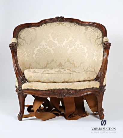 null Shepherd's chair in molded and carved natural wood, the curved backrest topped...
