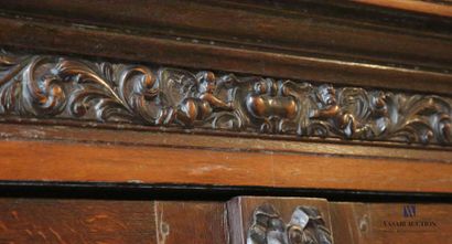 null Cabinet in molded and carved oak, it opens in front of two leaves decorated...