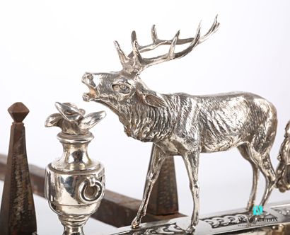 null Pair of silver-plated bronze andirons featuring a deer and a dog holding a hare...
