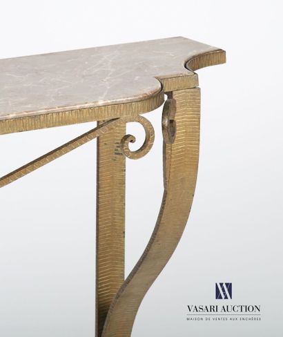 null Console in wrought iron with a golden patina, the dark veined marble top is...