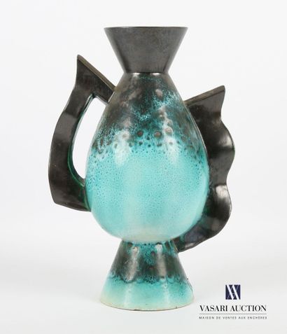 null Earthenware vase in green hues, the ovoid body flanked by an openwork grip on...