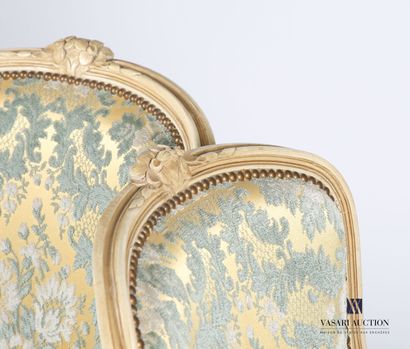 null Pair of bergères in molded and carved natural wood, lacquered cream, the backrest...