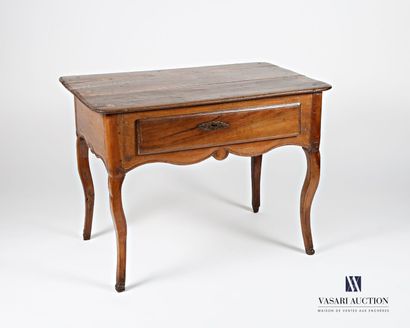 null Writing table in molded natural wood, it opens in belt by a drawer underlined...