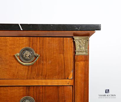 null Chest of drawers in natural wood and wood veneer, it is topped with a black...