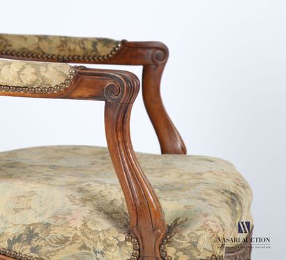 null Armchair in natural wood, molded and carved, the straight back, the armrests...