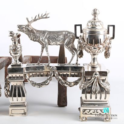 null Pair of silver-plated bronze andirons featuring a deer and a dog holding a hare...