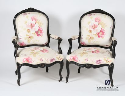 null Pair of armchairs in molded, carved and blackened wood, the backrest is topped...