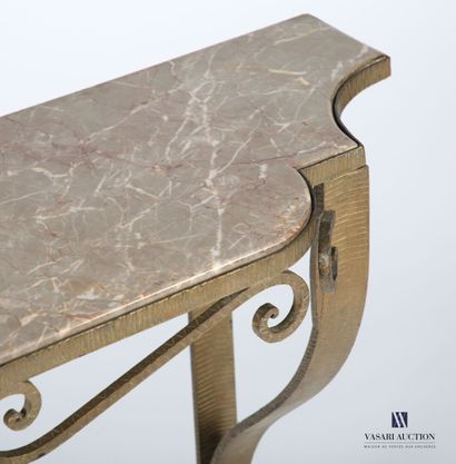 null Console in wrought iron with a golden patina, the dark veined marble top is...