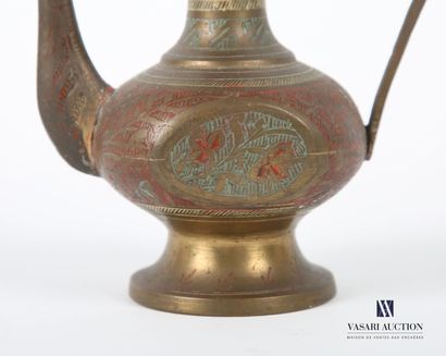 null MIDDLE EAST 
Ewer, in brass treated in polychromy and engraved with stylized...