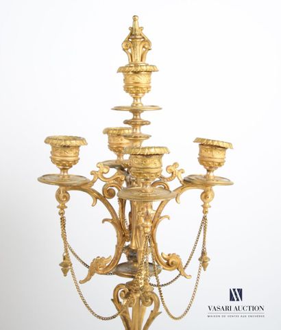 null Regula mantel set with a golden and silver patina, including a clock and a pair...