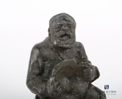 null COUZTES
Wax subject representing a drunken sailor sitting with a bowl in his...