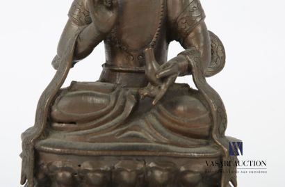 null SOUTHEAST ASIA - SINO TIBETAN
Seated divinity in brown patina bronze resting...