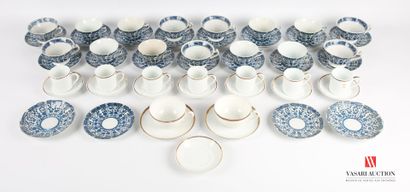 null Set of porcelain including two tea cups and their under cup in white porcelain...