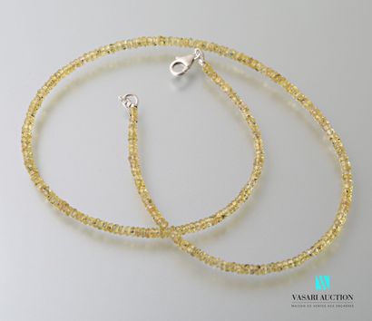 Necklace of faceted yellow sapphires in fall,...