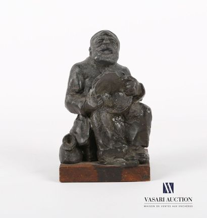 null COUZTES
Wax subject representing a drunken sailor sitting with a bowl in his...