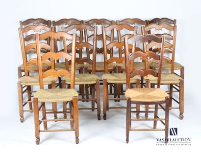 Suite of eleven chairs in natural wood, the...