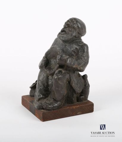 null COUZTES
Wax subject representing a drunken sailor sitting with a bowl in his...
