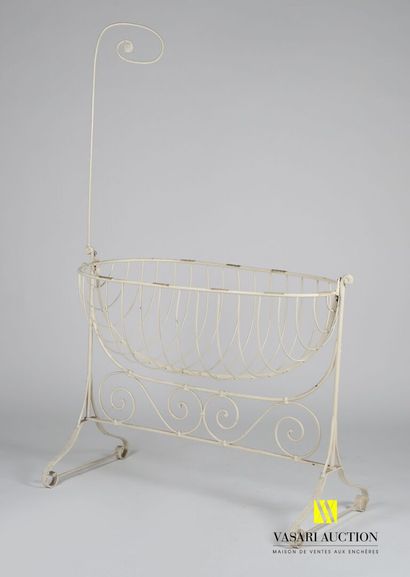 White lacquered wrought iron cradle in the...