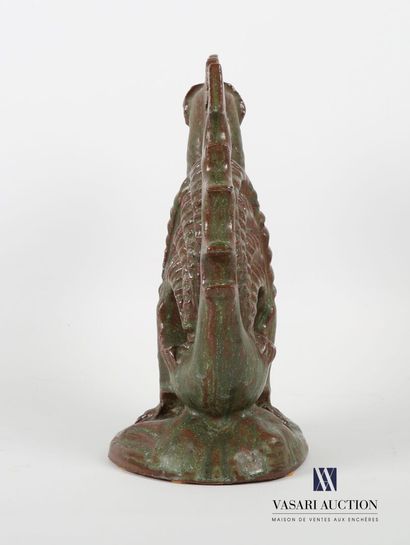 null Green patina terracotta subject representing a stylized dragon
20th century
Height...