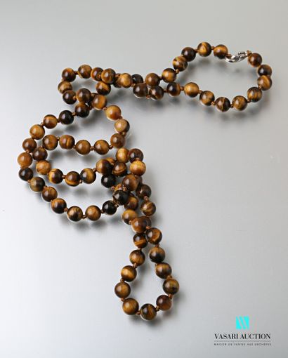 Long necklace made of tiger eye beads, the...