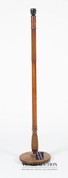 Floor lamp in natural wood standing on a...