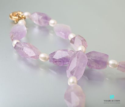 null Necklace adorned with faceted amethysts alternating with white freshwater pearls,...