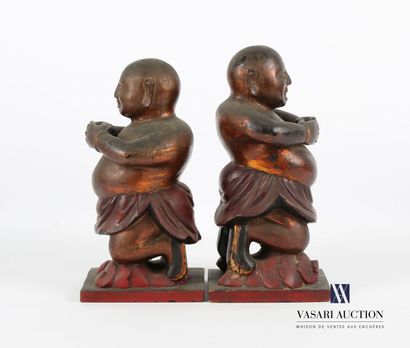 null Two subjects in red lacquered wood with gold highlights, representing men on...