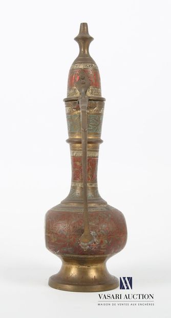 null MIDDLE EAST 
Ewer, in brass treated in polychromy and engraved with stylized...