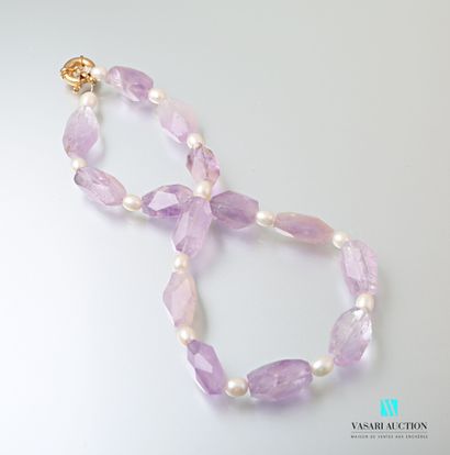 null Necklace adorned with faceted amethysts alternating with white freshwater pearls,...