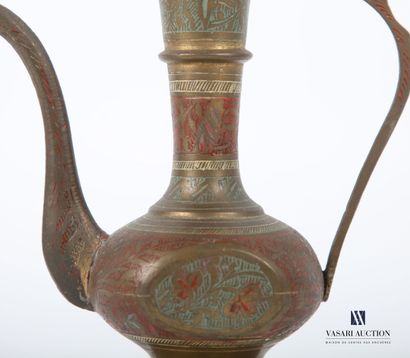 null MIDDLE EAST 
Ewer, in brass treated in polychromy and engraved with stylized...