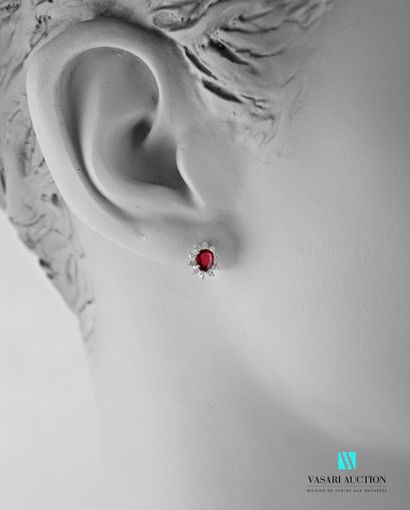 null Pair of oval-shaped white gold earrings set with two treated oval-cut rubies...