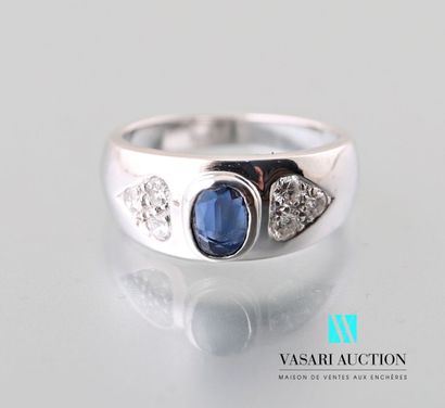 null White gold ring 750 thousandths decorated with an oval sapphire in closed setting...