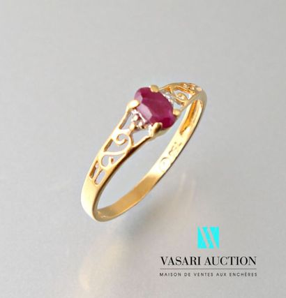 null Yellow gold ring 750 thousandth set with an oval ruby with two small diamonds...