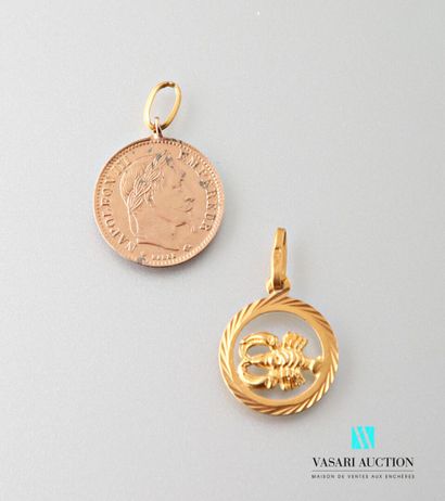 null Two round pendants in gold 585 thousandths: an imitation of 10 francs coin and...