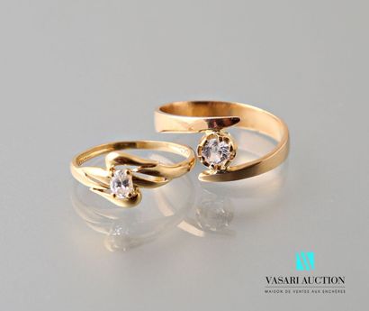 null Two rings in yellow gold 750 thousandths and white stones with a crossed pattern...