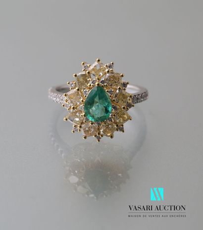 null Yellow and white gold ring set with a pear-cut emerald of 0.55 carat in a setting...