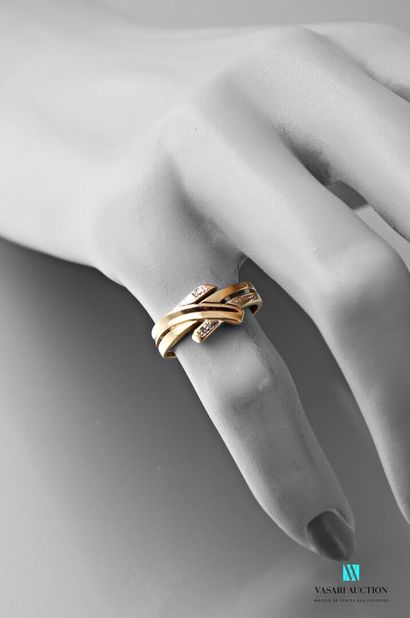 null Ring in yellow gold 750 thousandths crossed motif set with two small diamonds...
