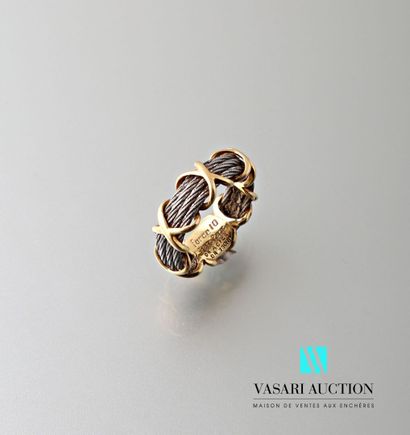 null Fred, Force 10 ring made of four steel cables with a yellow gold wire, signed
Gross...