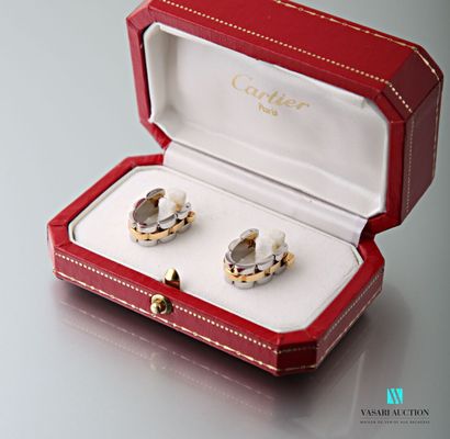 null Cartier, pair of cufflinks in yellow gold 750 thousandths and steel in the form...
