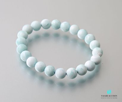 null Bracelet decorated with Larimar beads on elastic cord.
