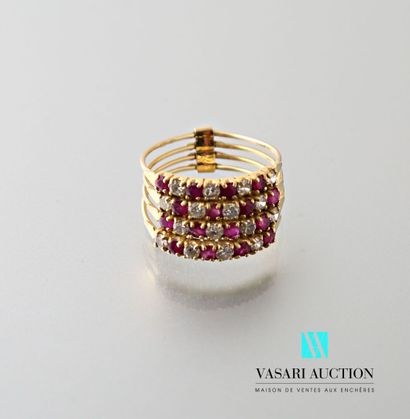 null Ring in yellow gold 750 thousandths formed by four rings set with four rubies...