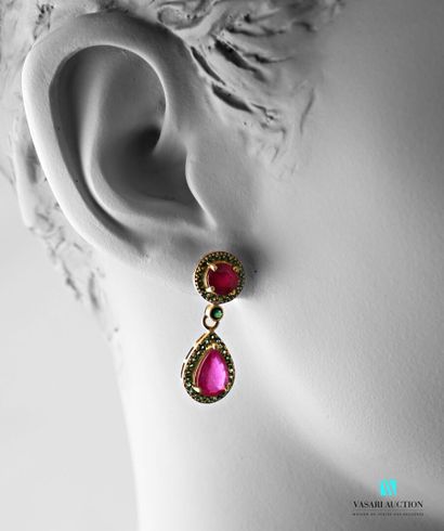 null Pair of gilt silver earrings set with round and pear-shaped treated rubies in...
