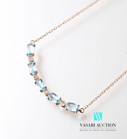 null Necklace in pink gold 750 thousandth supporting a crescent set with five topazes...