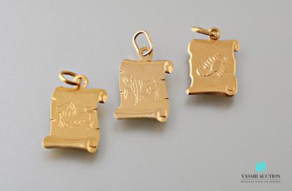 null Three pendants in yellow gold 750 thousandths in the shape of parchment engraved...